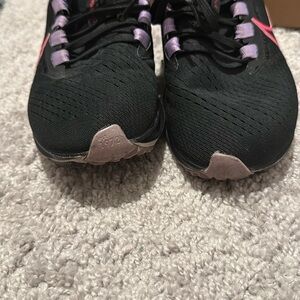 Nike Black and Pink Athletic Shoes with Sleek Design